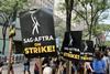 SAG-AFTRA members picketing outside NBC Universal in New York