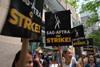 Members of SAG-AFTRA picket outside of NBC Universal at Rockefeller Center on second day of strike.