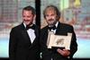 Peter Jackson receives the Honorary Palme d Or from Elijah Wood during the Opening Ceremony as part of the 79th Cannes Film Festival in Cannes