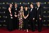 Tessa Ross, Peter Straughan, Edward Berger, Isabella Rossellini, Juliette Howell, Ralph Fiennes and Michael Jackman poses with the Outstanding British Film Award for 'Conclave'