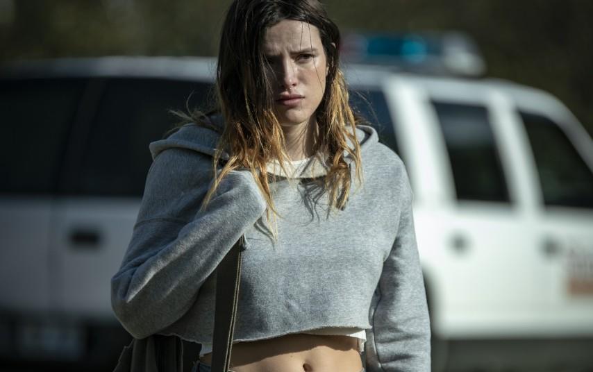 Bella Thorne flaunts her chiseled midriff in Devils gear