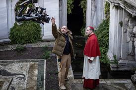 Director Edward Berger and actor Ralph Fiennes on the set of CONCLAVE_Credit_Philippe Antonello-Focus Features