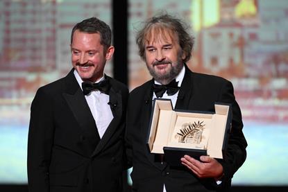 Peter Jackson receives the Honorary Palme d Or from Elijah Wood during the Opening Ceremony as part of the 79th Cannes Film Festival in Cannes
