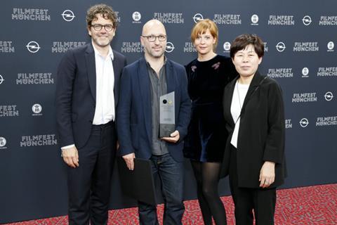 Producer Tiago Hespanha receives prize on behalf of Pedro Pinho from CineVision Award