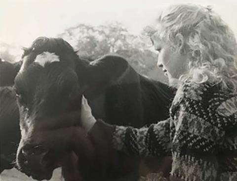 Andrea Arnold as an 18 year old meeting a cow properly for the fisrt time_Credit courtesy of Andrea Arnold