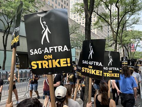 SAG-AFTRA members picketing outside NBC Universal in New York