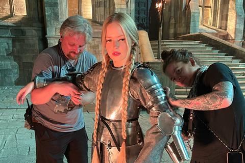Ellie Bamber suits up on set of 'The Face Of Horror'