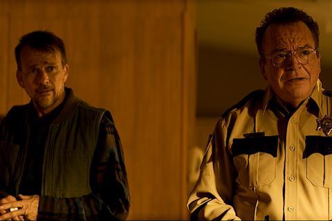 (L-R): Sean Patrick Flannery and Tom Arnold in 'Sacred Evil'