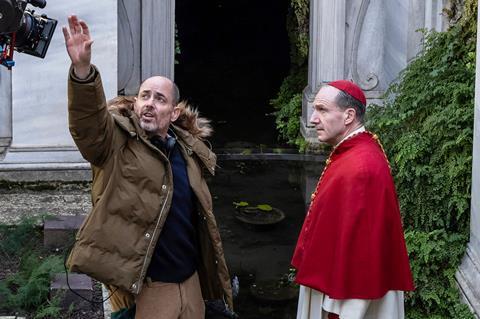 Director Edward Berger and actor Ralph Fiennes on the set of CONCLAVE_Credit_Philippe Antonello-Focus Features