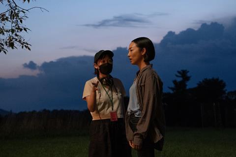 Celine Song with Greta Lee on the 'Past Lives' set