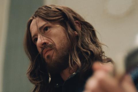 Joseph Quinn as George Harrison