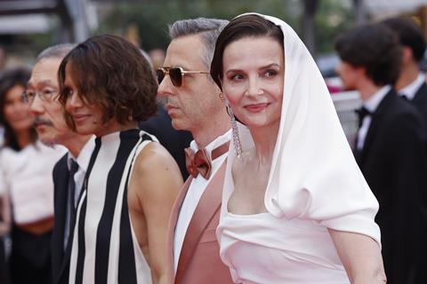 Juliette Binoche takes to the opening-night red carpet for 'Leave One Day' alongside her fellow jurors, (from left) director Hong Sang-soo and actors Halle Berry and Jeremy Strong