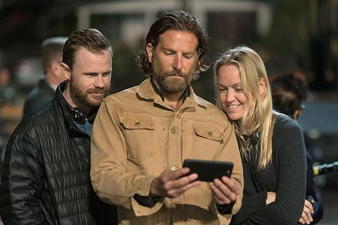 Lynette Howell Taylor (right) with director Bradley Cooper and production co-executive Weston Middleton c Universal