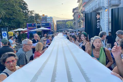 Gaza protest shroud being held up at Locarno Film Festival