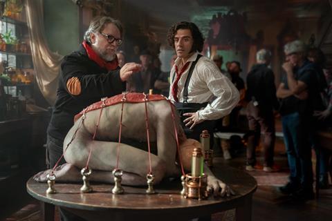 Oscar Isaac with Guillermo del Toro on the set of 'Frankenstein'