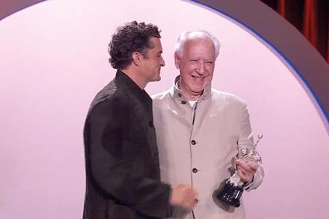 Werner Herzog collects the Donostia Award from Orlando Bloom at the start of the 2026 San Sebastian International Film Festival