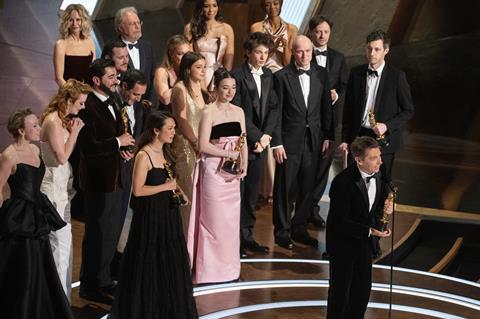 Sean Baker accepts the Oscar® for Best Picture alongside Samantha Quan, Mikey Madison, Mark Eydelshteyn, Sean Bake, Yuriy Borisov and Alex Coco at the 2025 Oscars